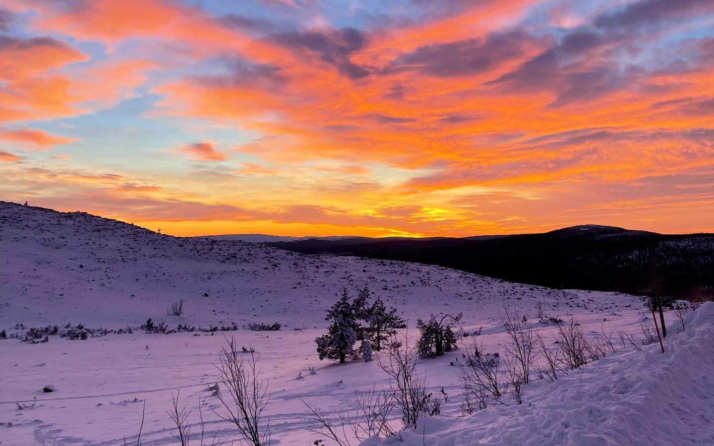 Sunset over a snow-covered fell near Rovaniemi